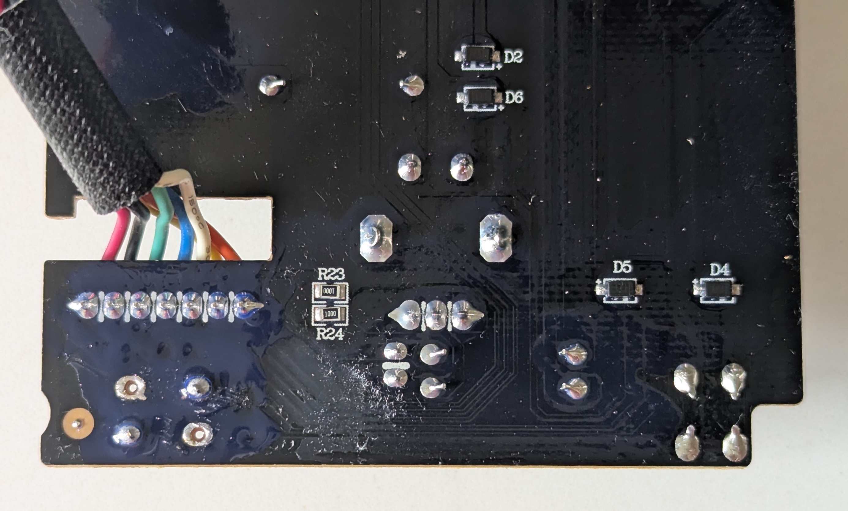 Conformal coat over the newly soldered button